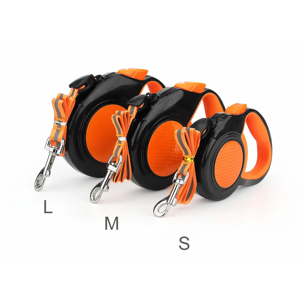 Retractable dog leashes in sizes L, M and S side by side