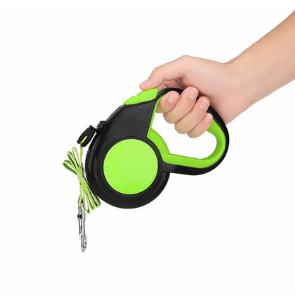 Green retractable dog leash held in one hand, showing the grip