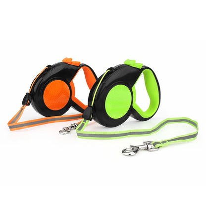Orange and green retractable dog leashes with the cords extended