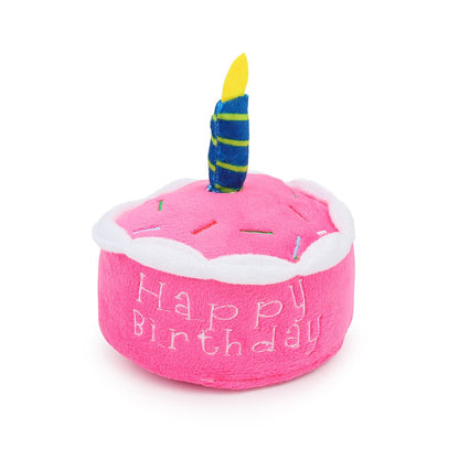 Pink round Happy Birthday cake dog toy with a striped candle
