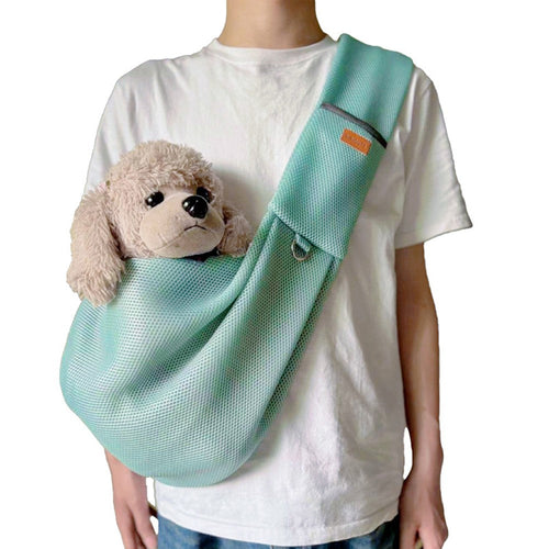 Breathable pet shoulder bag in mint worn crossbody, shown with a plush toy dog