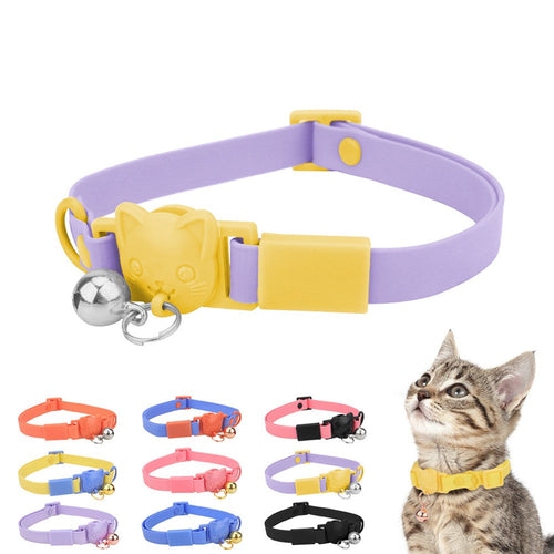 Kitten wearing a yellow PVC cat collar with bell beside ten candy colour collars