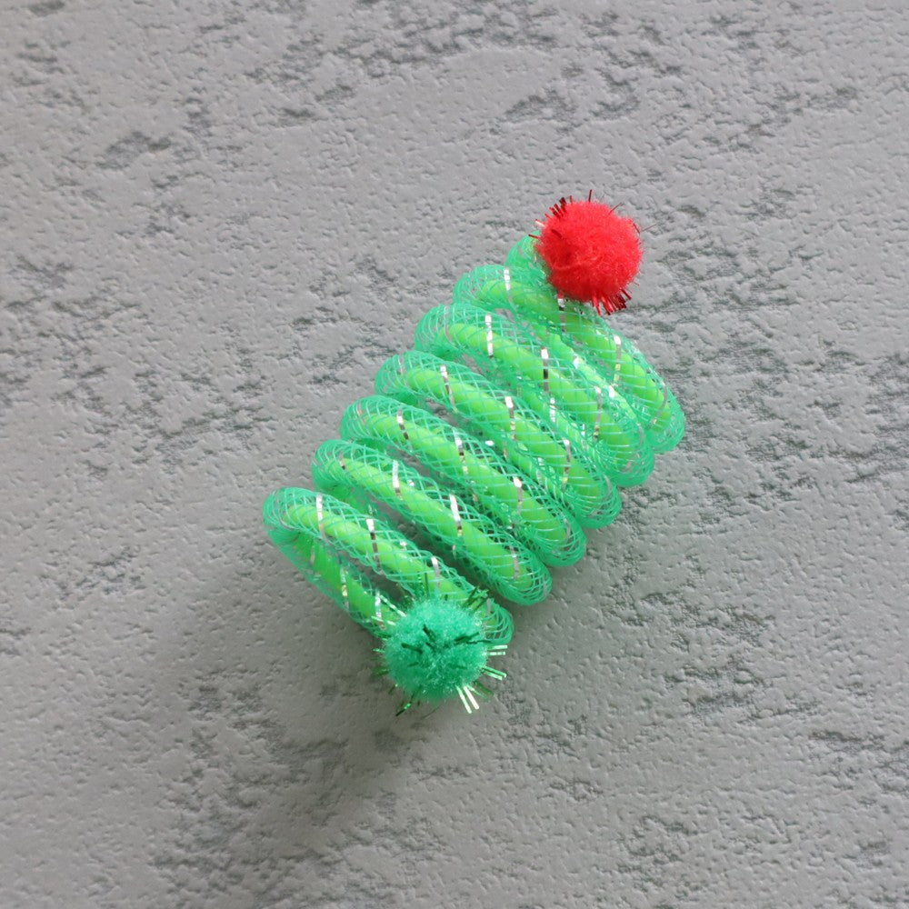 Green plastic coil spring cat toy, close-up