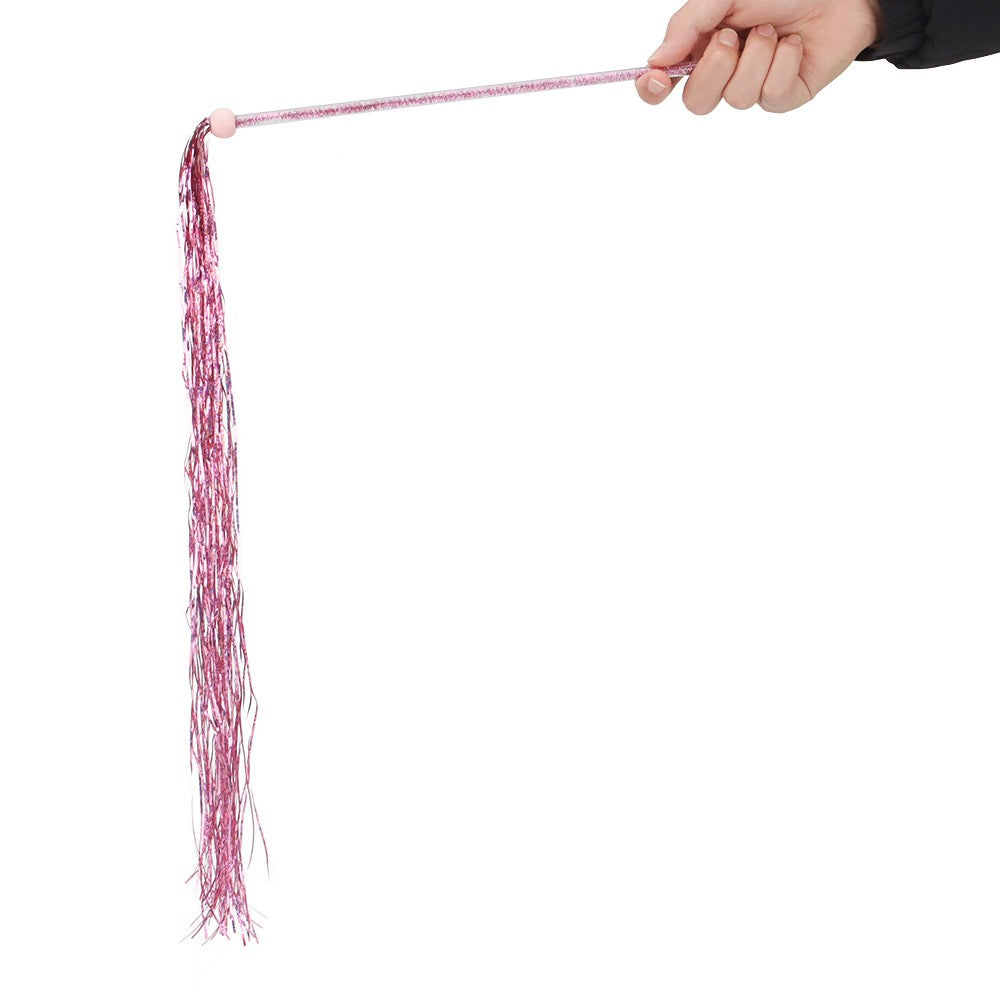 Pink tassel cat toy hanging from a hand-held rod