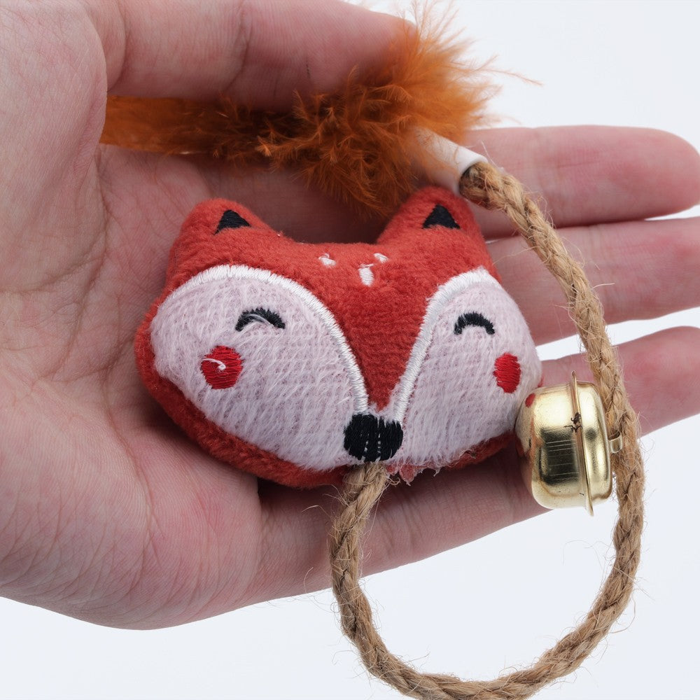 Fox face catnip toy with a feather tail, bell and rope loop