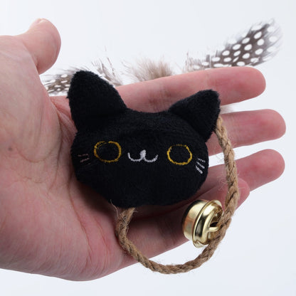 Black cat face catnip toy with a feather tail, bell and rope loop