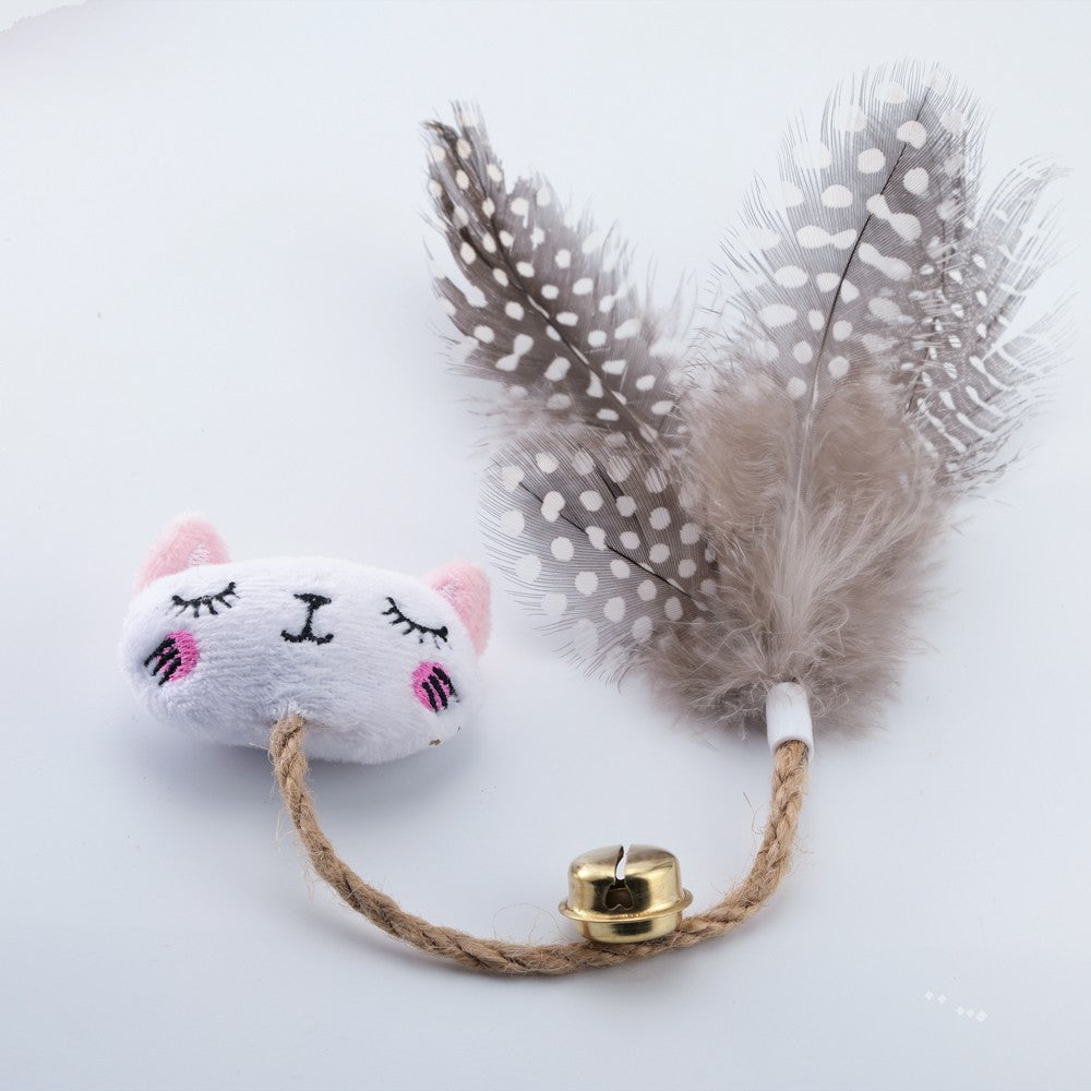 White cat face catnip toy with speckled feathers