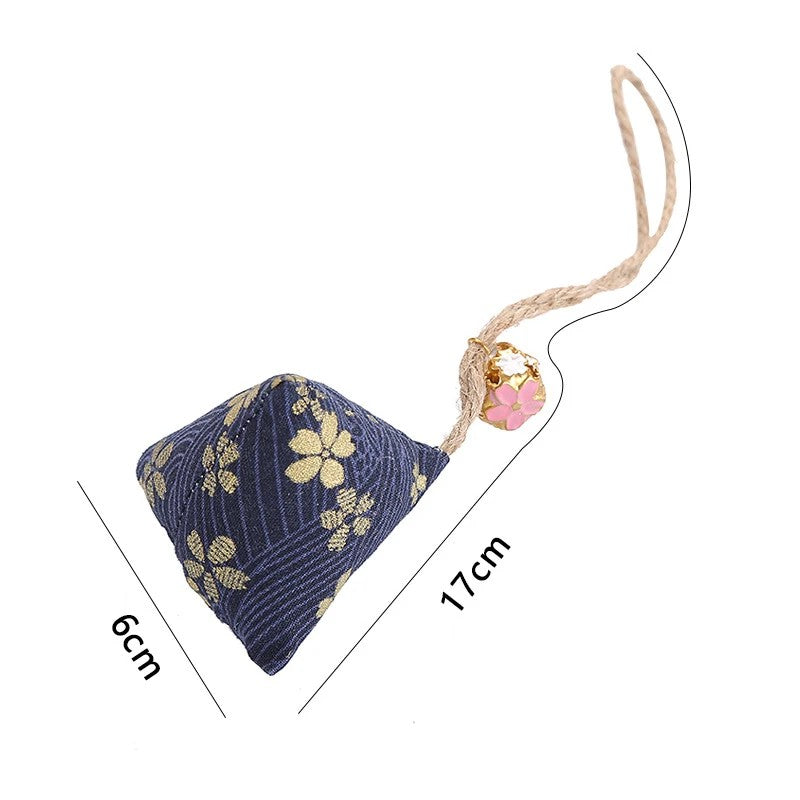 Navy floral catnip sachet, about 6 cm wide and 17 cm long with the rope