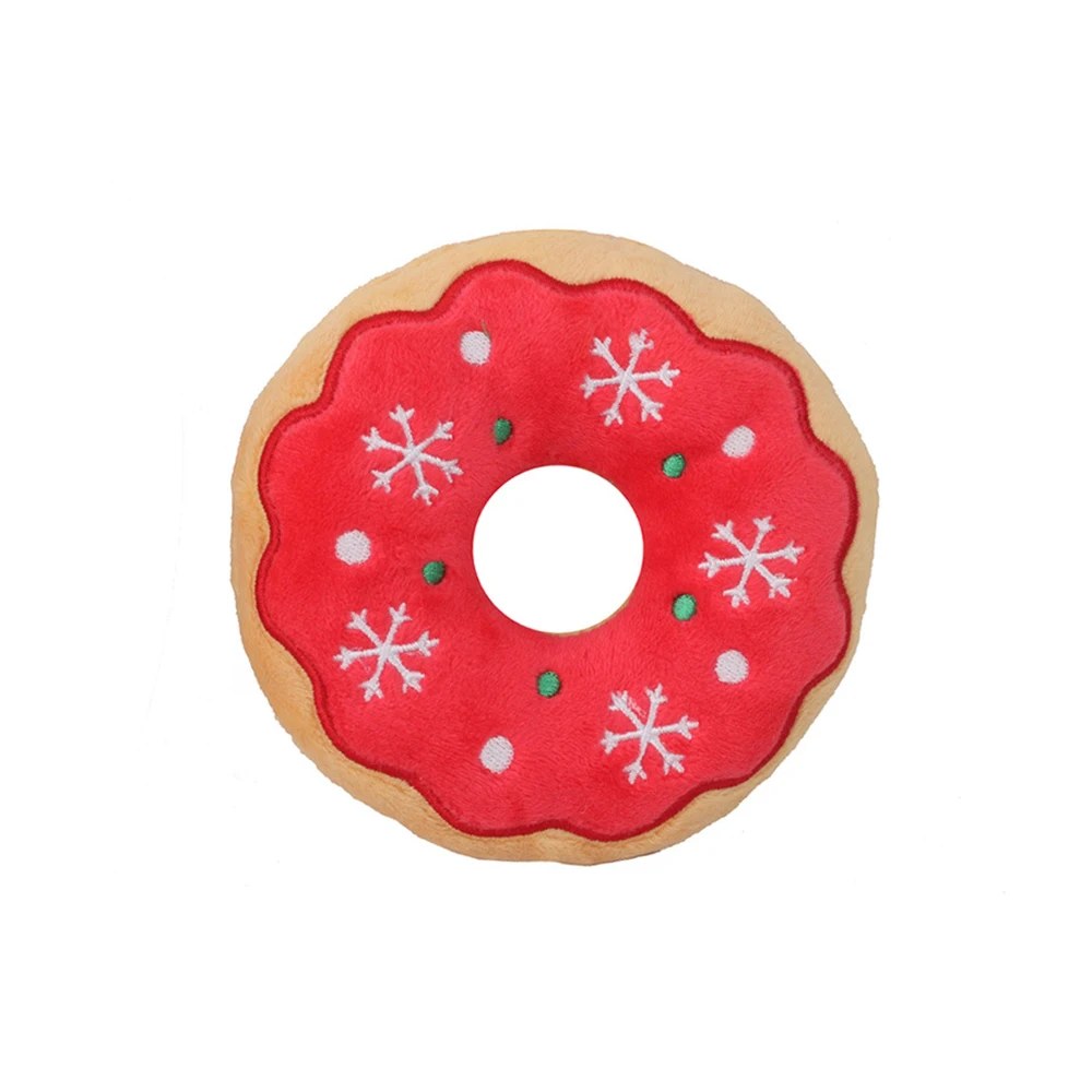 Red donut dog toy with snowflake icing, top view