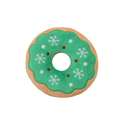 Green donut dog toy with snowflake icing, top view