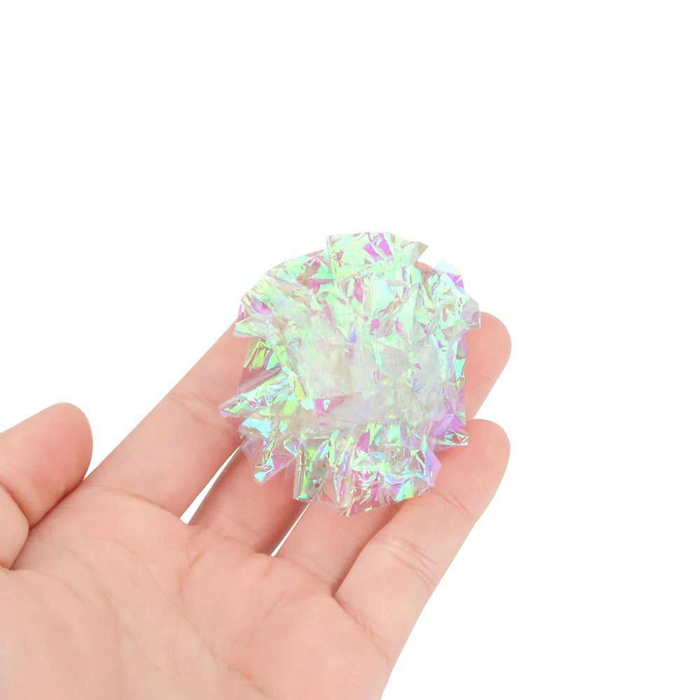 Hand holding a shiny crinkle ball