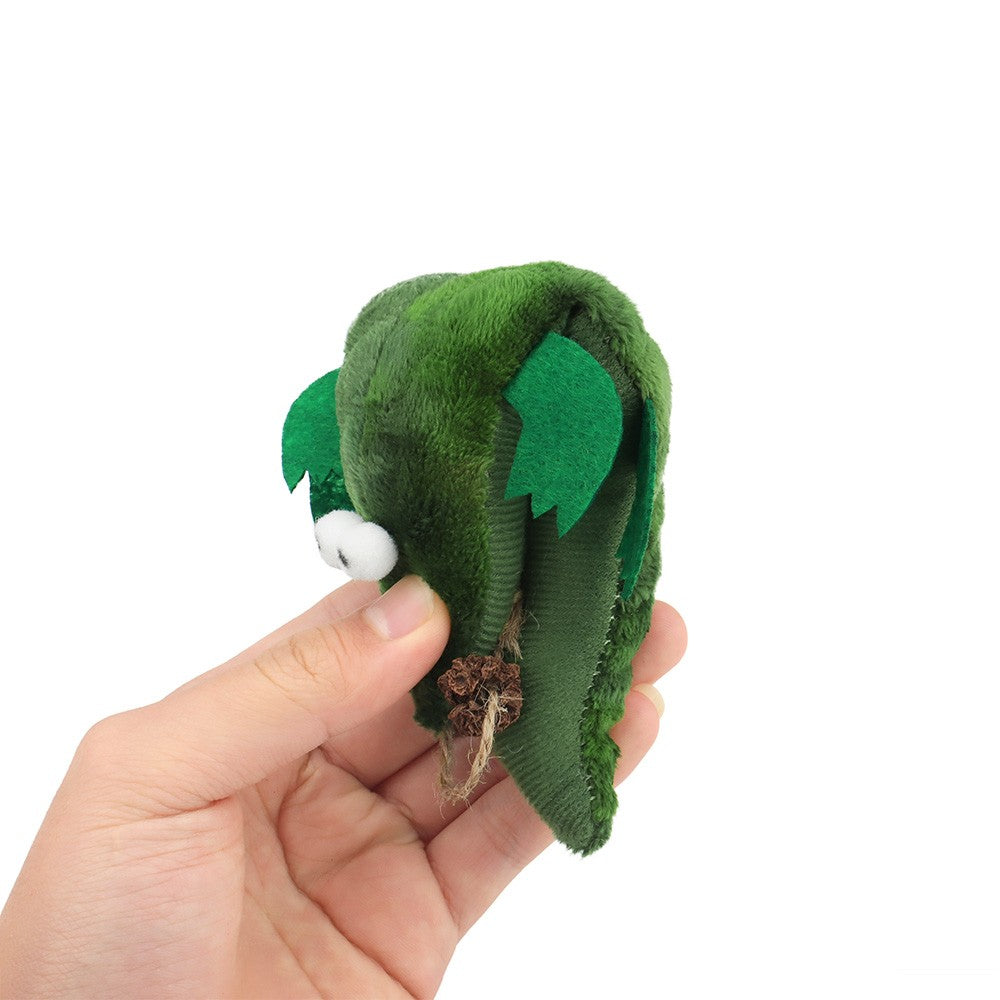 Crocodile cat toy folded in a hand to show how soft it is