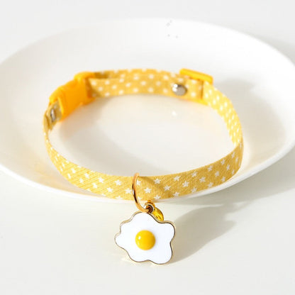 Yellow star print cat collar with fried egg charm