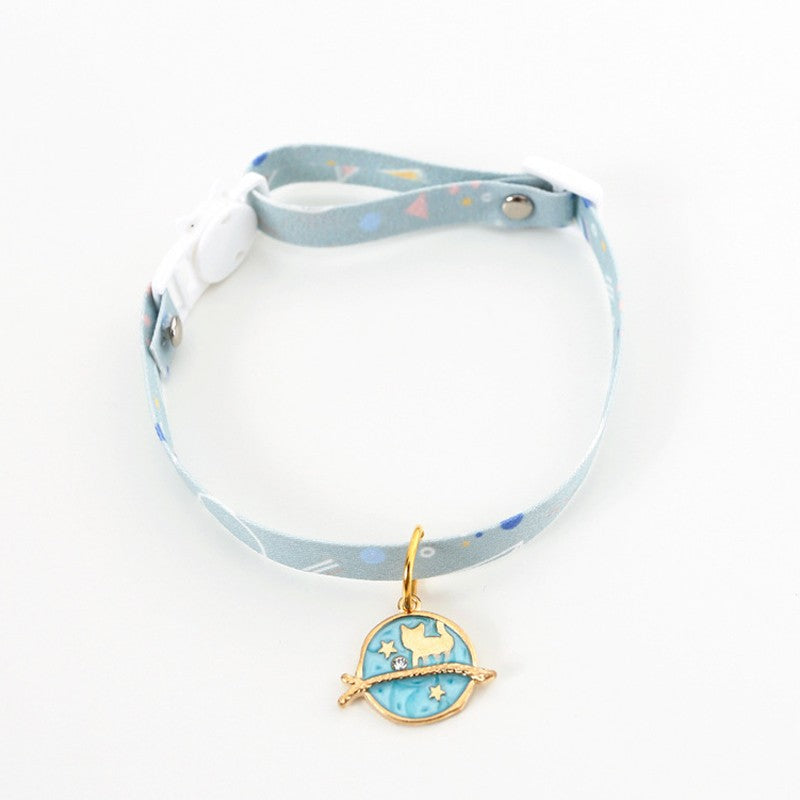 Light blue cat collar with a blue planet and cat charm