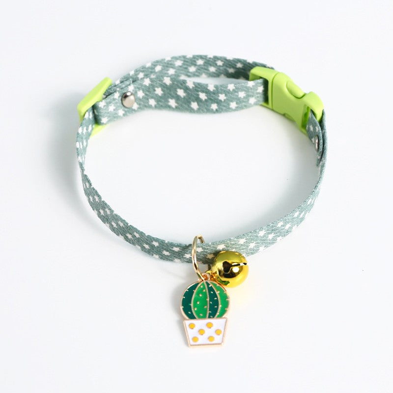 Green polka dot cat collar with bell and cactus charm