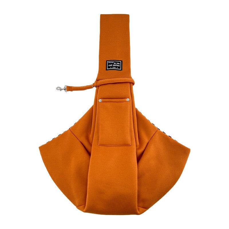 Orange-brown dog carrier bag with gingham lining and leash clip