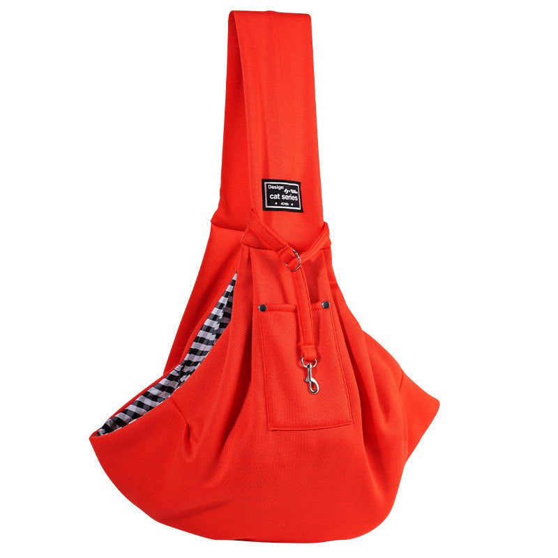Orange-red dog carrier bag with gingham lining