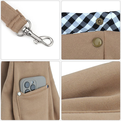 Dog carrier bag details: safety leash clip, button closure, phone pocket and soft cotton-feel fabric