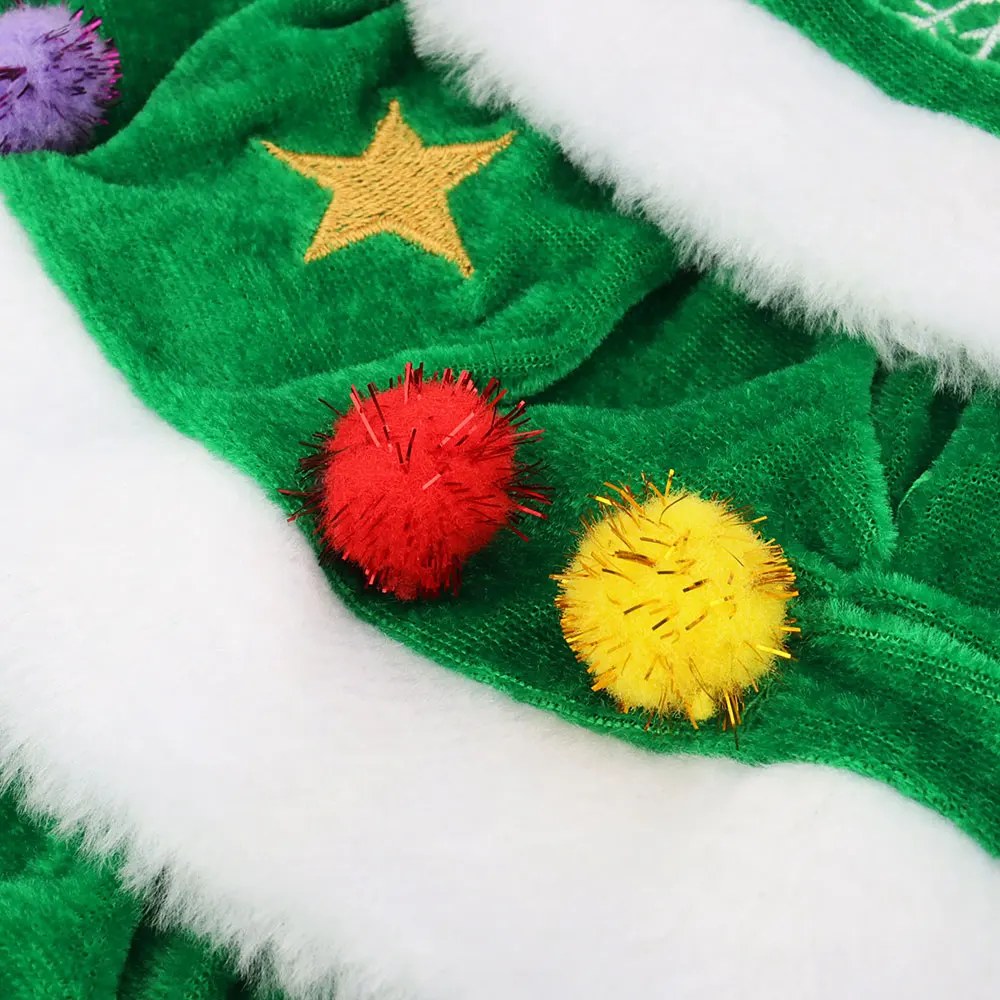 Close-up of a gold star and pompoms on the green fleece