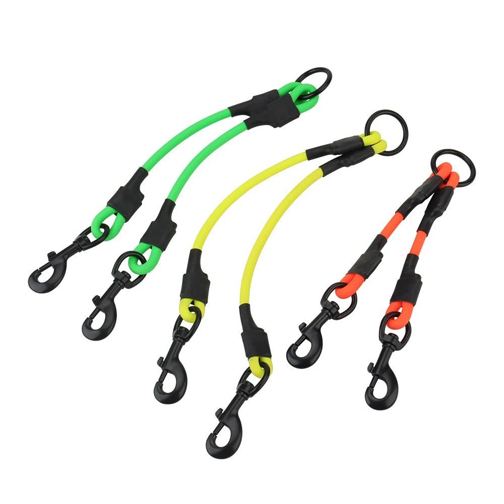 Dog leash couplers in neon orange, yellow and green