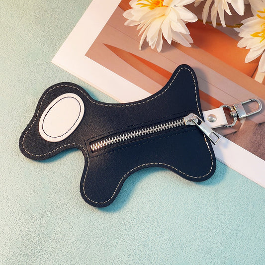 Black dog-shaped PU leather poop bag dispenser with zip pocket and metal clip