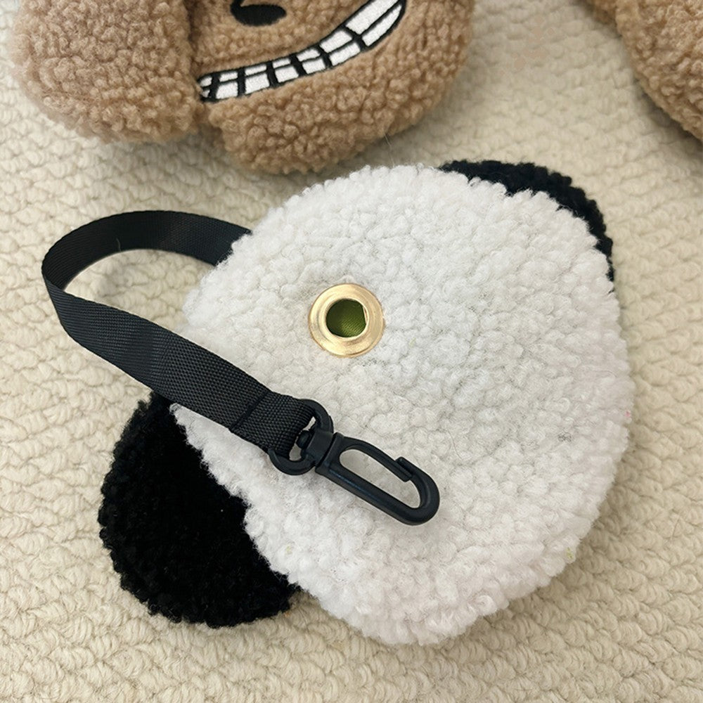 Back of the plush poop bag holder with the metal eyelet for bags
