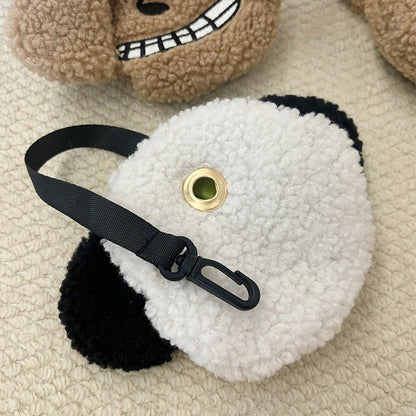 Back of the plush poop bag holder with the metal eyelet for bags