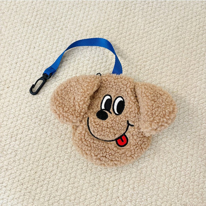 Tan plush poop bag holder with a tongue-out face
