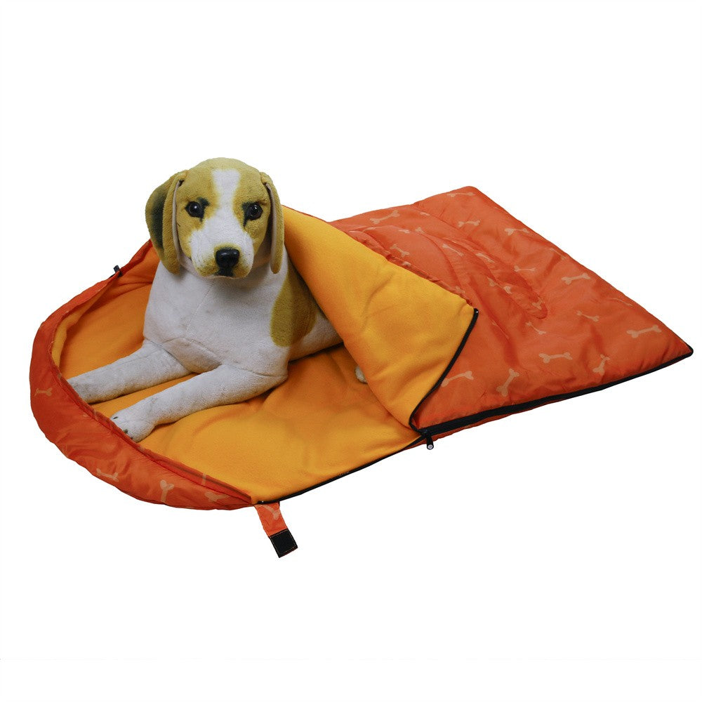 Beagle resting in the open orange dog sleeping bag