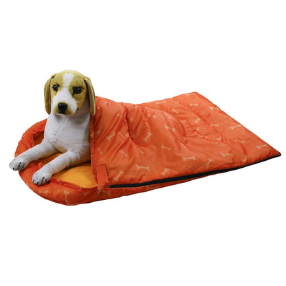 Beagle tucked inside the orange camping dog bed