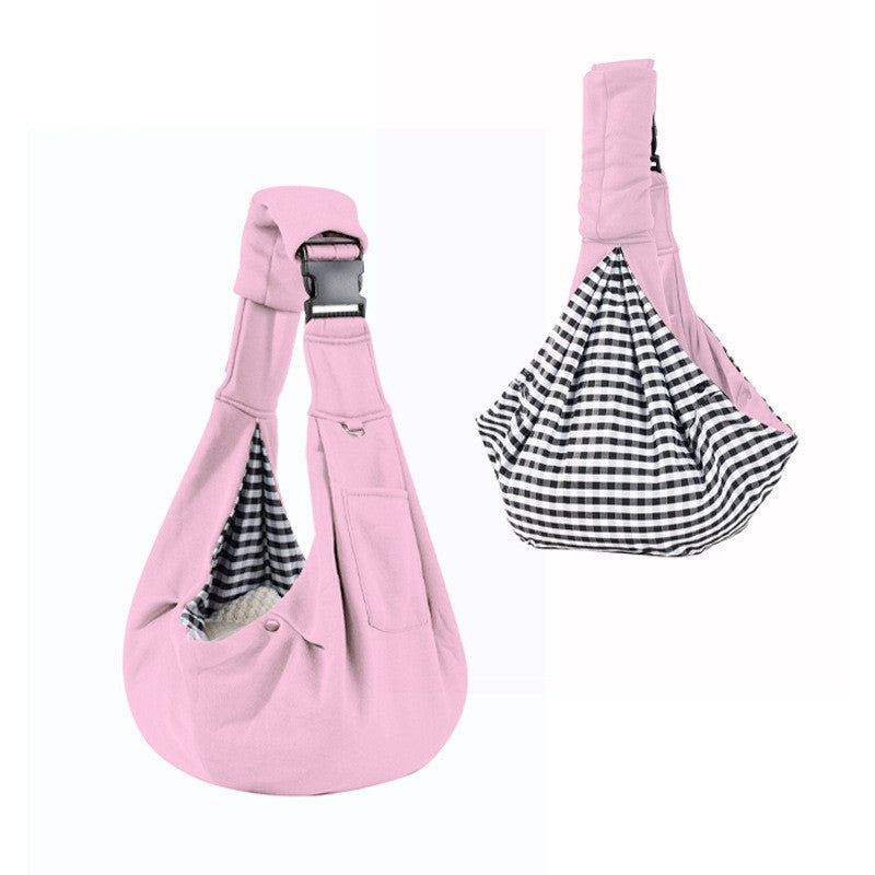Pink dog sling carrier with reversible houndstooth side