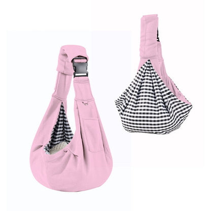 Pink dog sling carrier with reversible houndstooth side