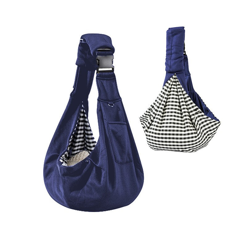 Navy blue dog sling carrier with reversible houndstooth side