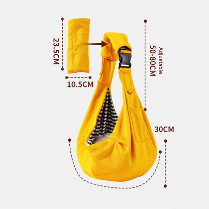 Dog sling carrier size: pouch about 65 cm wide and 30 cm deep, strap adjusts from about 50 to 80 cm