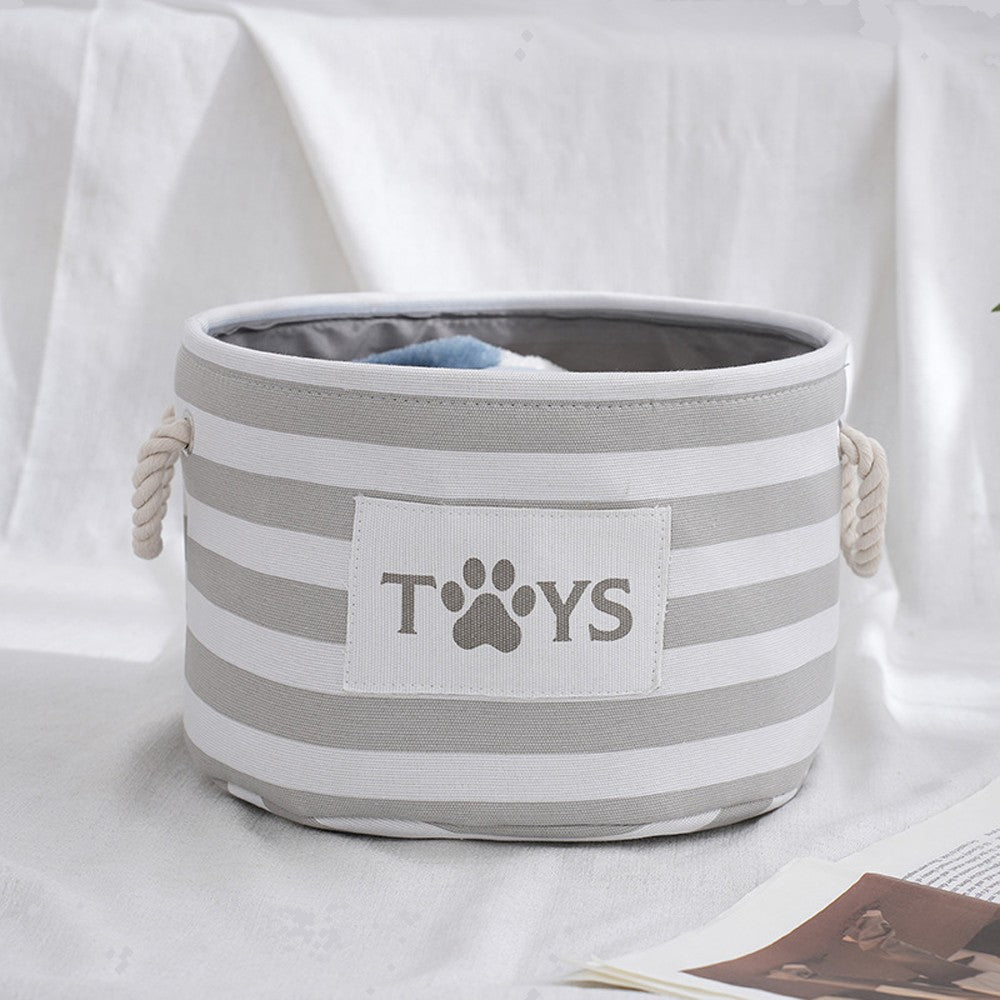 Round striped dog toy basket in gray with a TOYS print patch