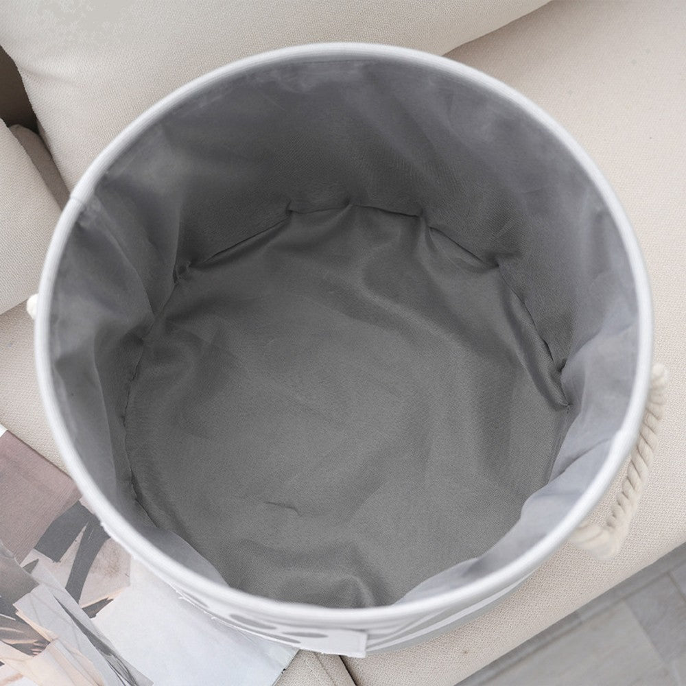 Inside of the round dog toy basket showing the gray fabric lining