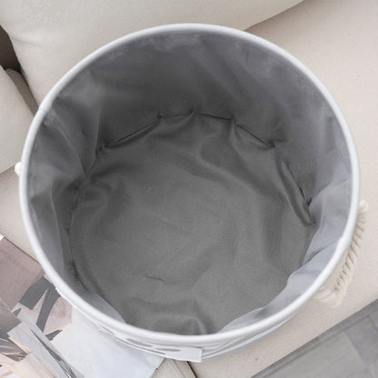 Inside of the round dog toy basket showing the gray fabric lining