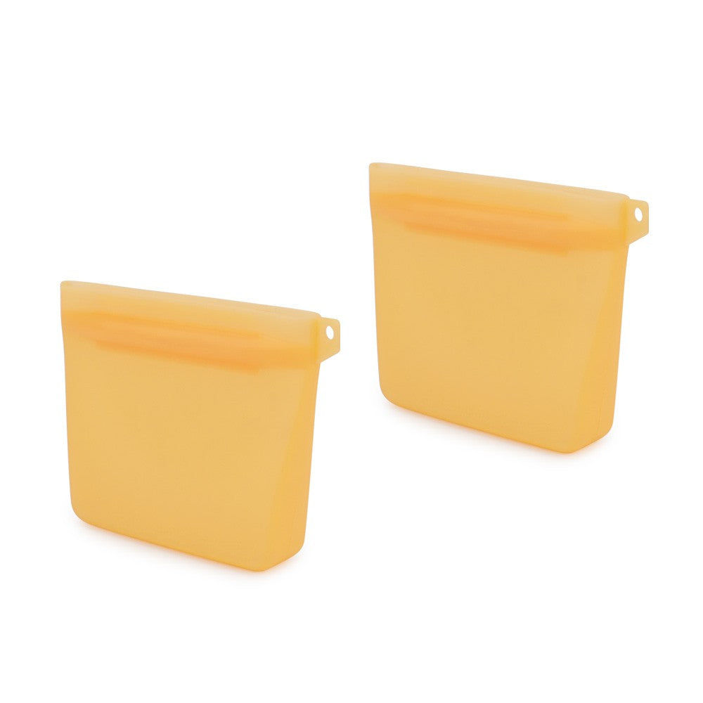 Two orange silicone dog treat bags