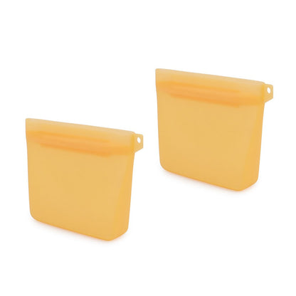 Two orange silicone dog treat bags