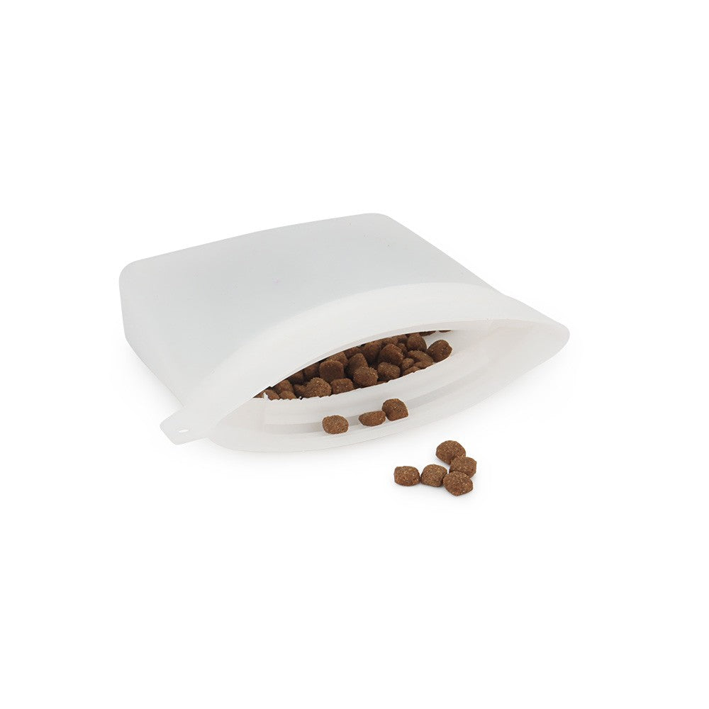 White silicone treat pouch open with dog kibble inside