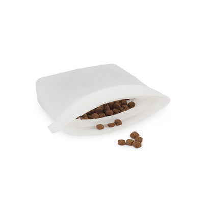 White silicone treat pouch open with dog kibble inside