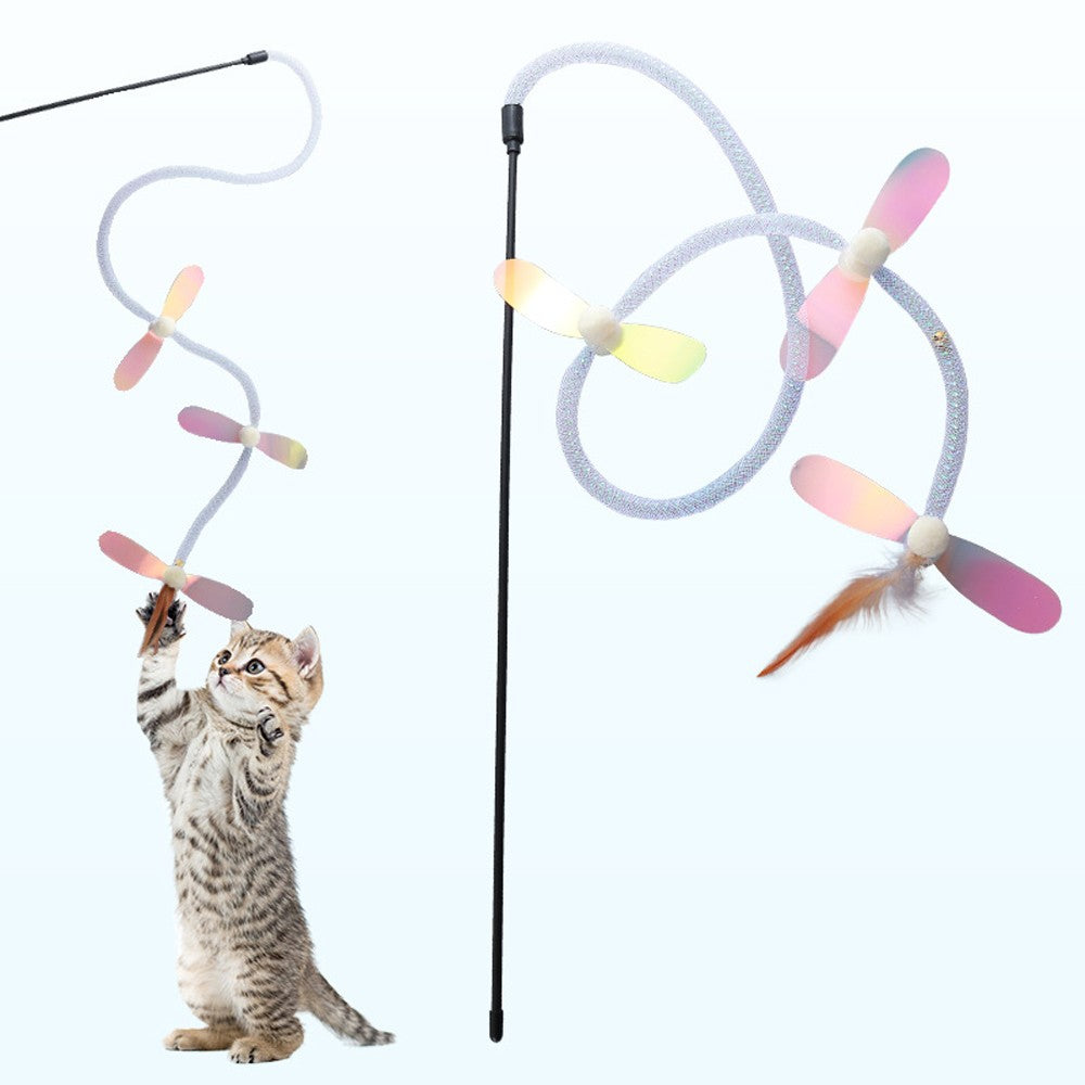 Kitten jumping at the dragonfly cat toy