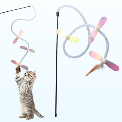 Kitten jumping at the dragonfly cat toy