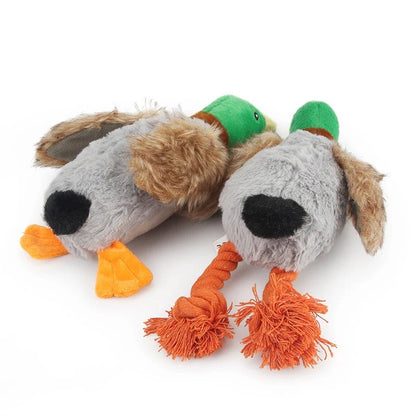 Two plush mallard dog toys lying down, back view of the feathers