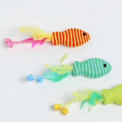Red, blue and green fish cat toys laid side by side