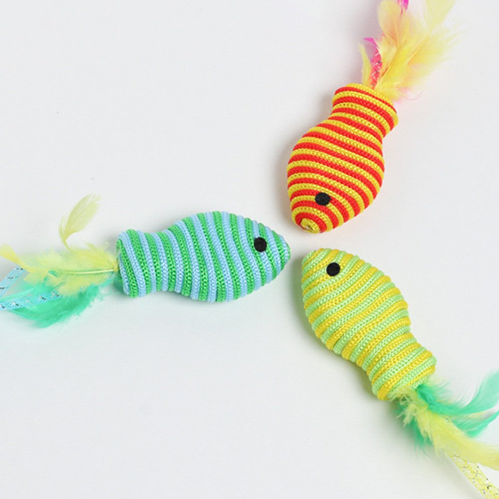 Fish cat toys arranged in a circle on a white surface