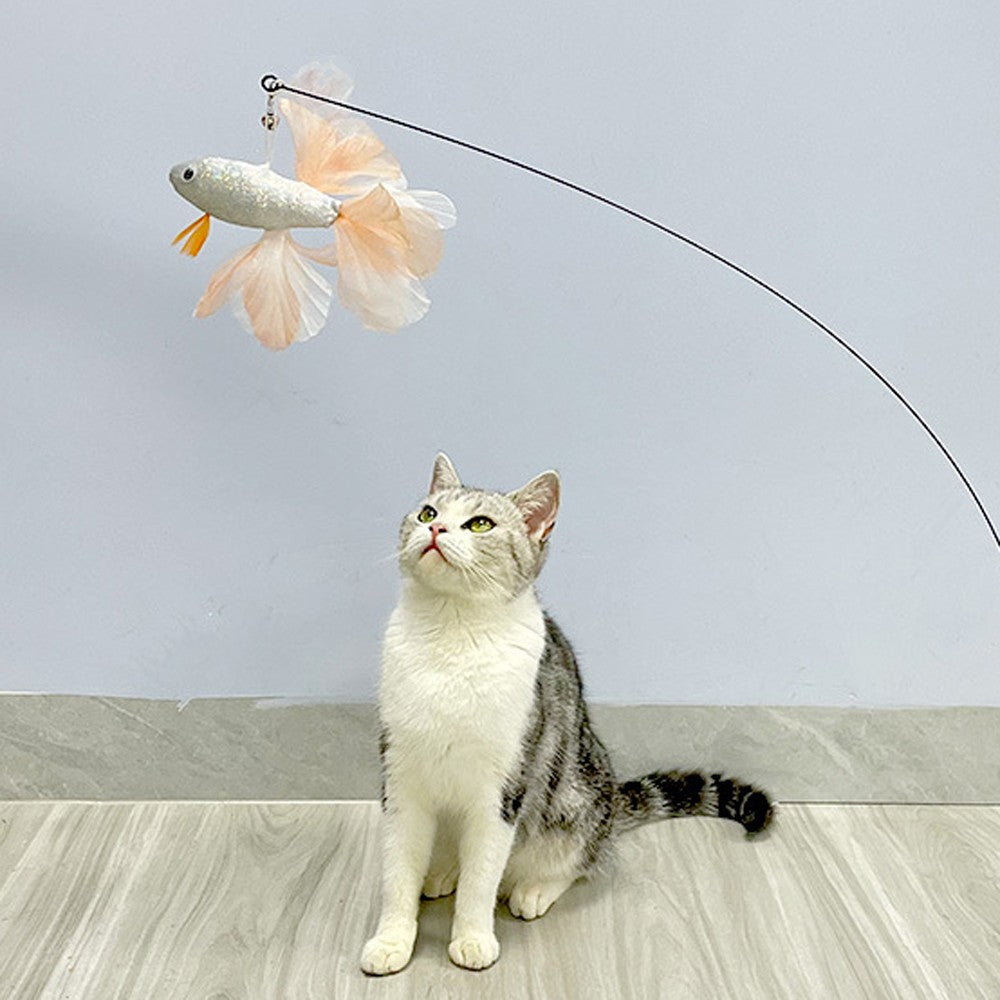 Cat looking up at the goldfish cat teaser dangling from the wand