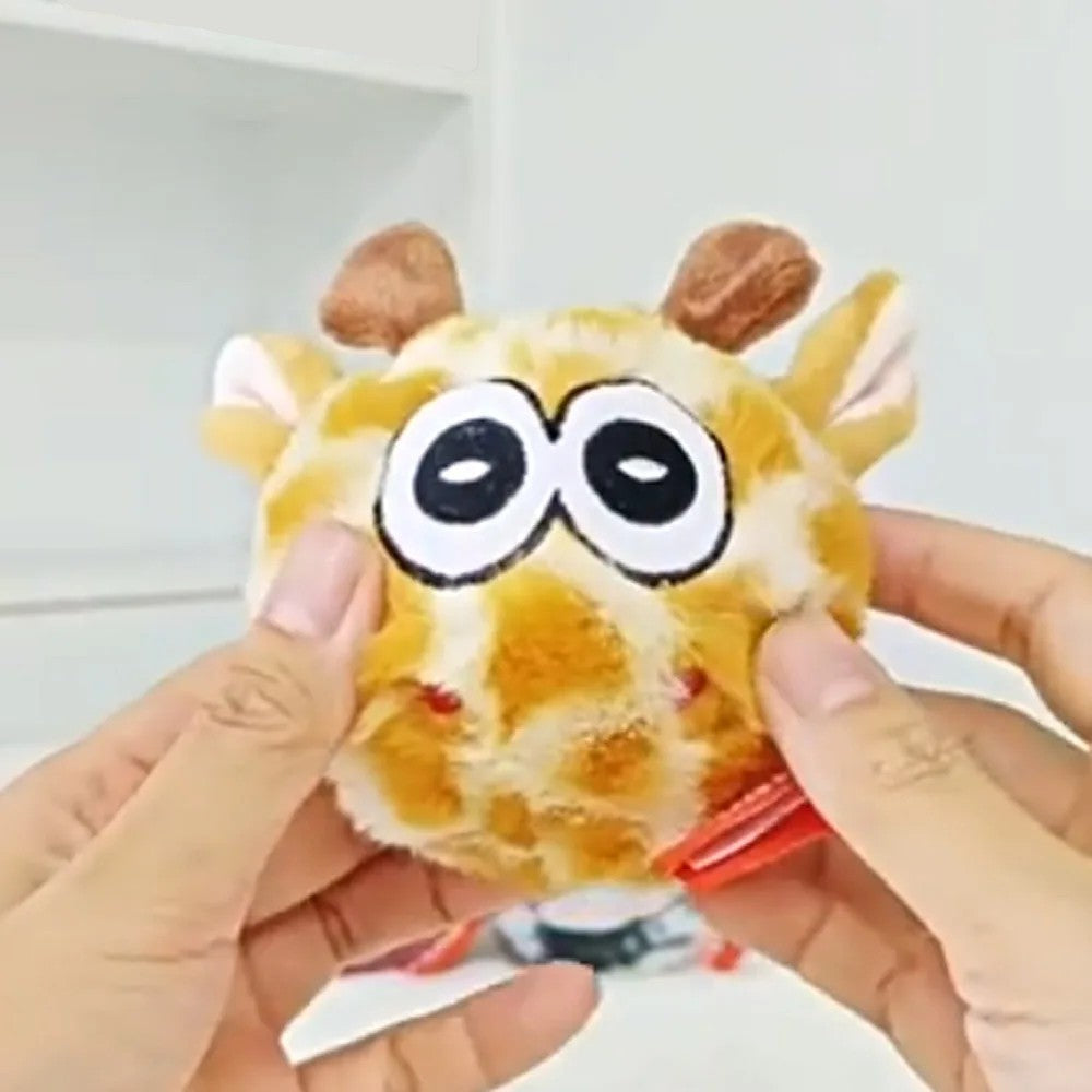 Hands holding the giraffe dog toy with big eyes