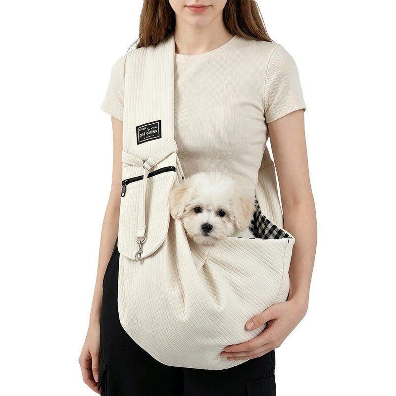 Rice white sling worn with a small dog