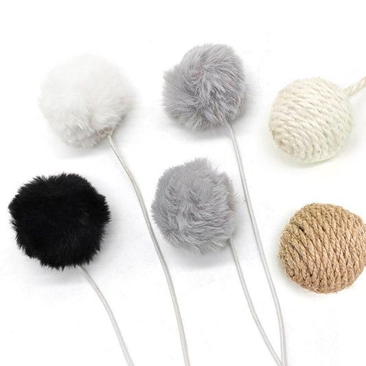 Hanging cat toy: fluffy pom-pom and sisal balls on elastic cords